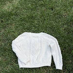 Pre-loved Amazon Essentials sofia grainge cream cable-knit cardigan, kids size 4T, back view, laid flat on grass