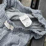 Pre-loved Aosta blue hickory stripe pull-on pants, kids size 2T, brand and size label close-up