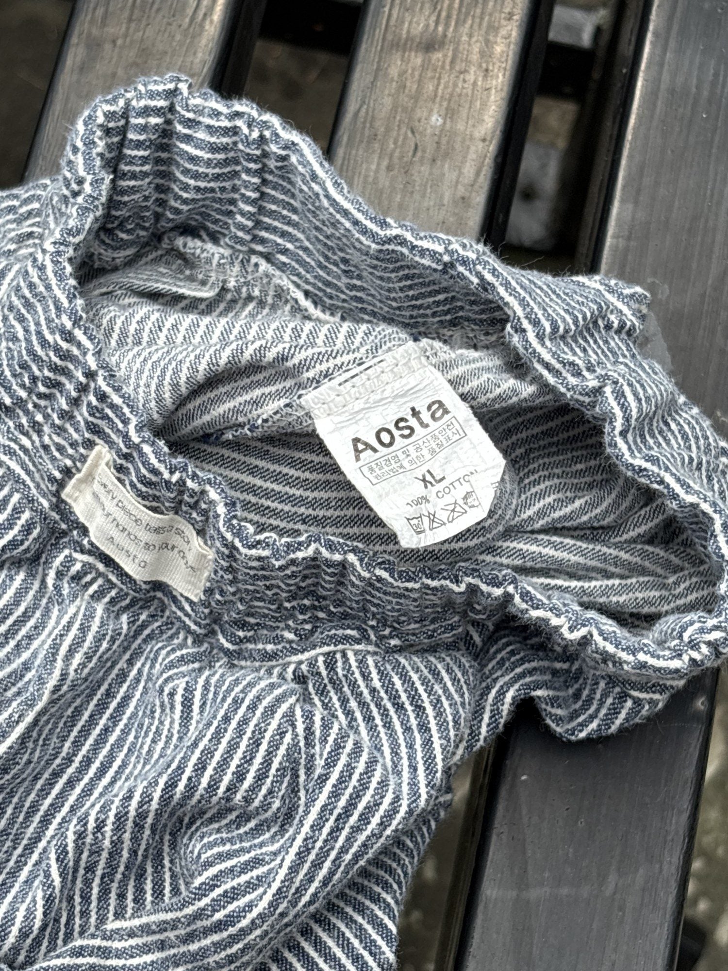 Pre-loved Aosta blue hickory stripe pull-on pants, kids size 2T, brand and size label close-up