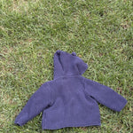 Pre-loved Gap navy bear-ear hooded knit cardigan, kids size 6-12M, back view, laid flat on grass