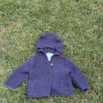Pre-loved Gap navy bear-ear hooded knit cardigan, kids size 6-12M, front view, laid flat on grass