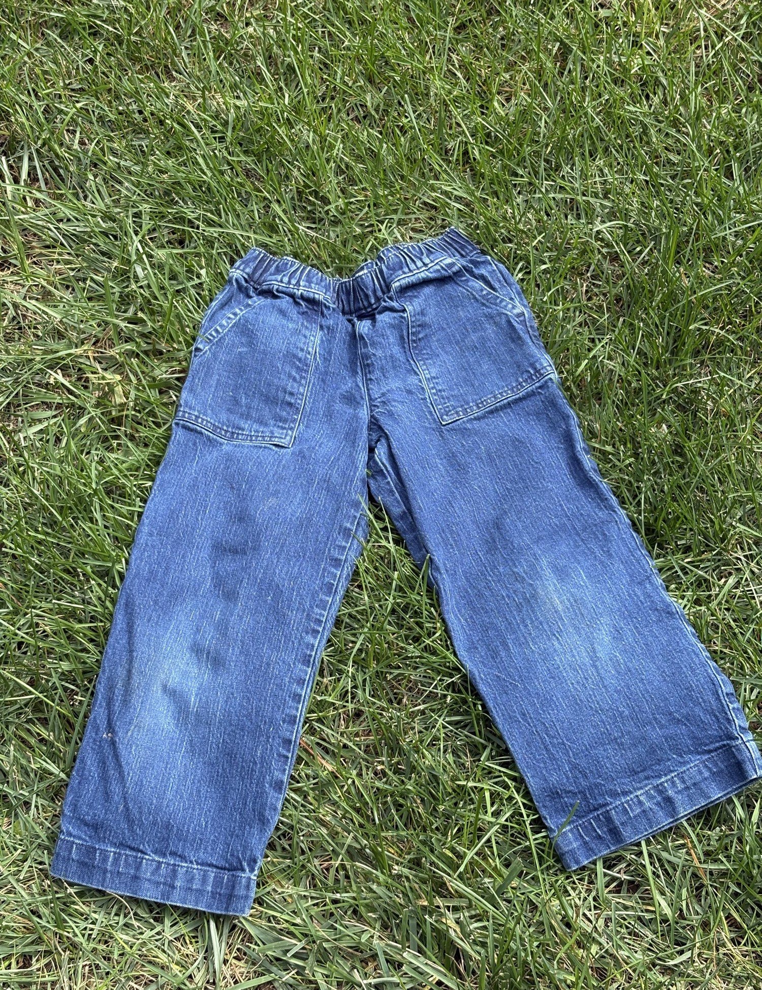 Pre-loved J.Crew wide-leg pull-on jeans, kids size 8, front view, laid flat on grass