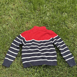 Pre-loved Nautica red and navy striped quarter-zip sweater, kids size 6, back view, laid flat on grass