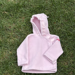Pre-loved Widgeon pink polartec fleece hooded jacket, kids size 9M, front view, laid flat on grass